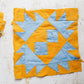 Vintage Set of 21 Orange & Blue Crow’s Foot Quilt Blocks, c1930